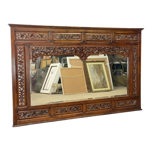 80 - A very large carved mahogany framed over-mantle mirror. 185x115cm