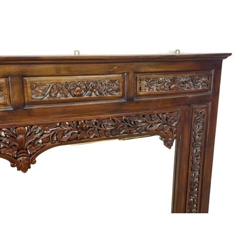 80 - A very large carved mahogany framed over-mantle mirror. 185x115cm