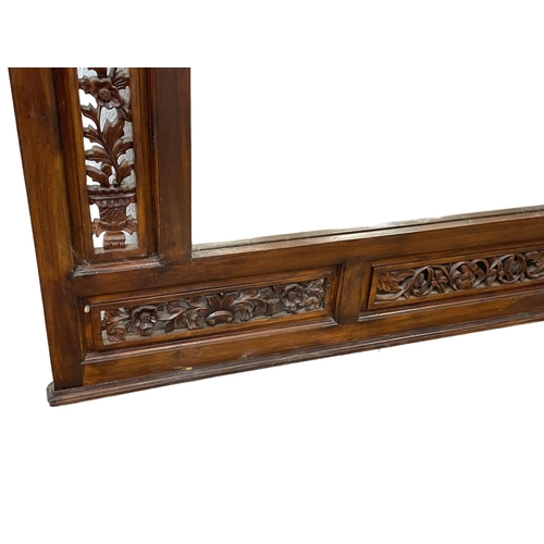 80 - A very large carved mahogany framed over-mantle mirror. 185x115cm