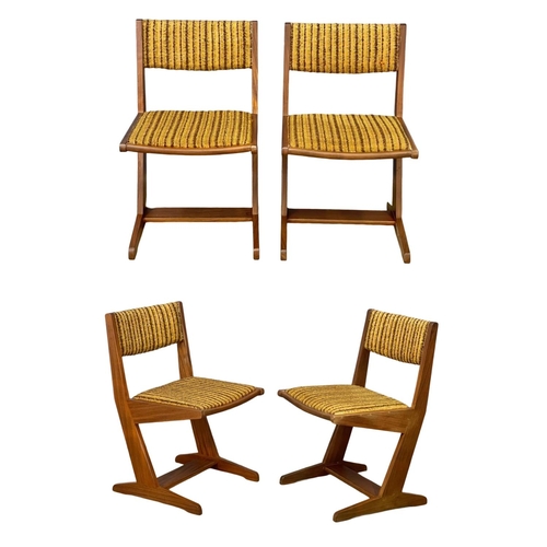 891 - A set of 4 Mid Century teak dining chairs with original upholstery.