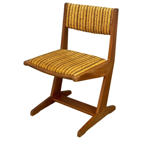 891 - A set of 4 Mid Century teak dining chairs with original upholstery.