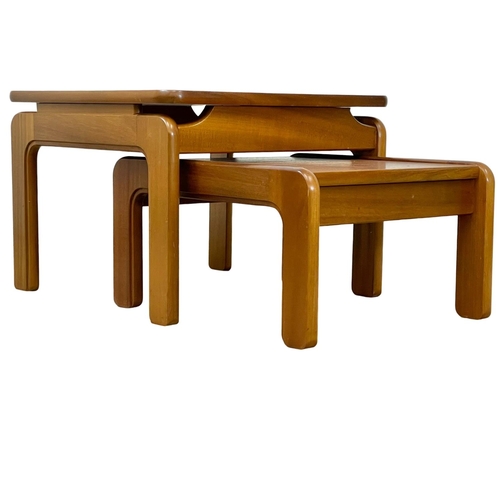 894 - A large Mid Century teak nest of tables. 60x60x44cm