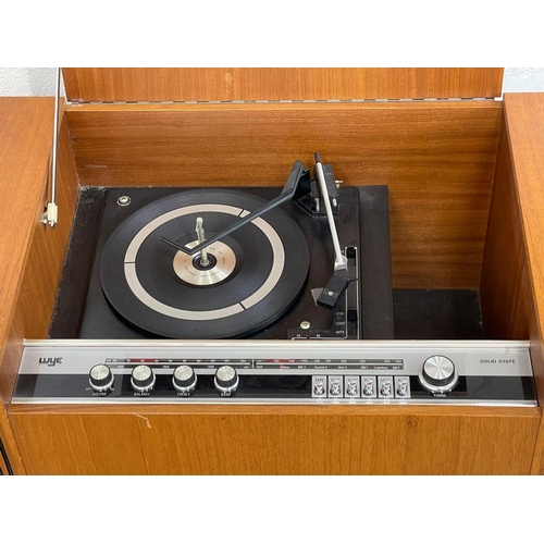 899 - A Mid Century teak radiogram. WYE Electronics LTD. 100x44.5c55cm