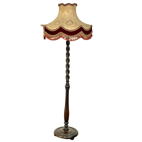 904 - A good quality 1930’s heavy oak standard lamp. 174cm