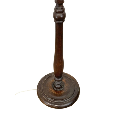 904 - A good quality 1930’s heavy oak standard lamp. 174cm