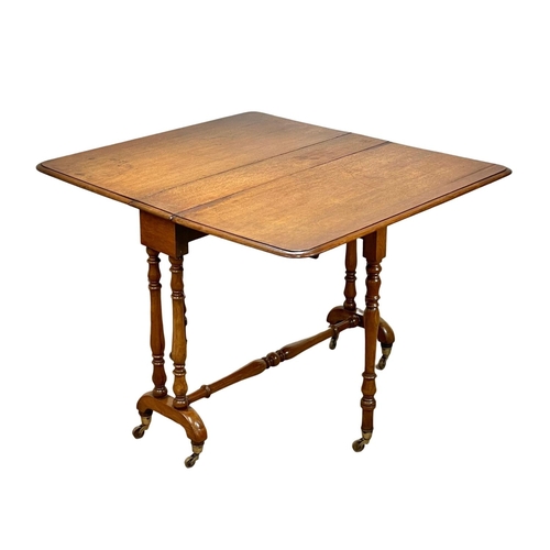 905 - A large Victorian oak Sutherland table on brass cup casters. Circa 1880. 102x90x73cm