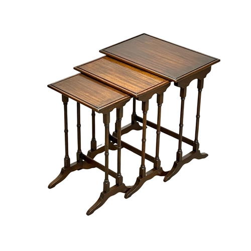 908 - A vintage mahogany Georgian style nest of tables.