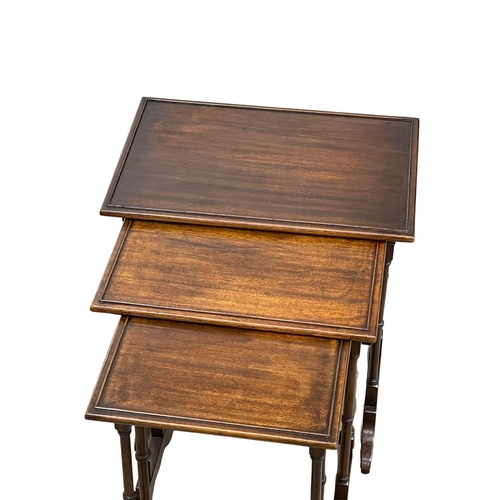 908 - A vintage mahogany Georgian style nest of tables.