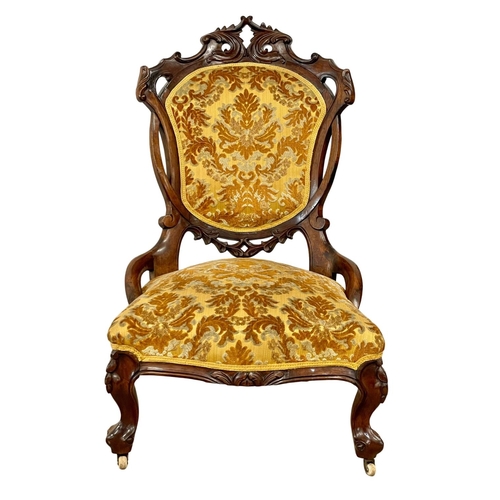 915 - A Victorian carved mahogany ladies nursing chair.