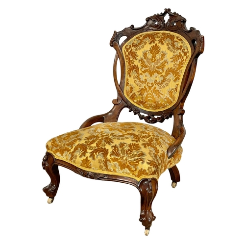 915 - A Victorian carved mahogany ladies nursing chair.