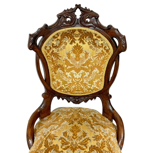 915 - A Victorian carved mahogany ladies nursing chair.