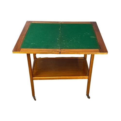 93 - A vintage turnover games table/ trolley. 66x40x74.5cm