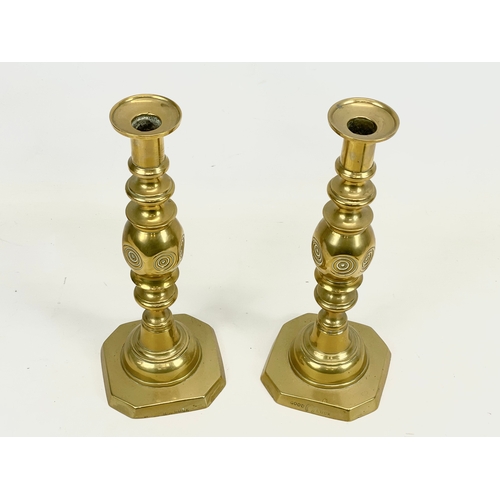 520 - A pair of Victorian “Bullseye” brass candlesticks. Good Luck. 28.5cm