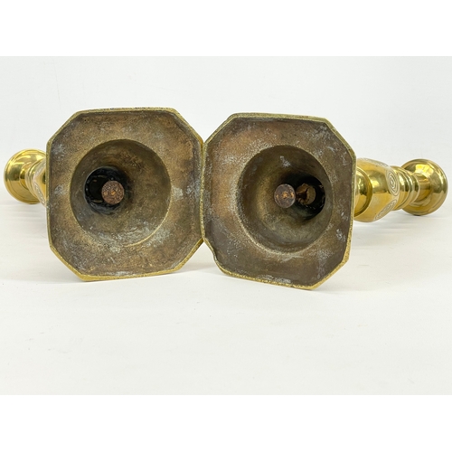 520 - A pair of Victorian “Bullseye” brass candlesticks. Good Luck. 28.5cm