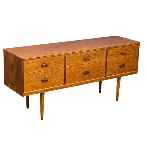 885 - A Mid Century teak sideboard with 6 drawer. 147x41x67cm