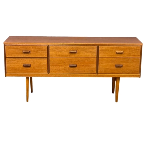 885 - A Mid Century teak sideboard with 6 drawer. 147x41x67cm