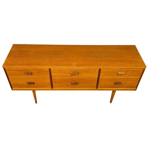 885 - A Mid Century teak sideboard with 6 drawer. 147x41x67cm