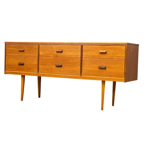 885 - A Mid Century teak sideboard with 6 drawer. 147x41x67cm