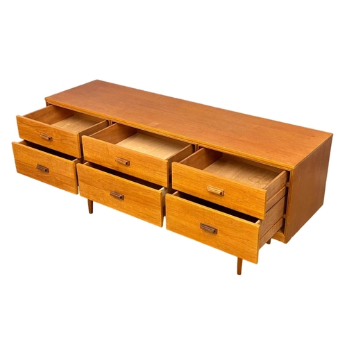 885 - A Mid Century teak sideboard with 6 drawer. 147x41x67cm