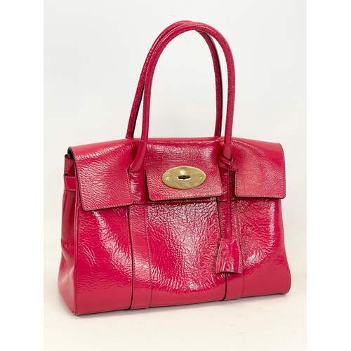 611 - A Mulberry Bayswater leather handbag with cover. 36 x 18 x 45cm