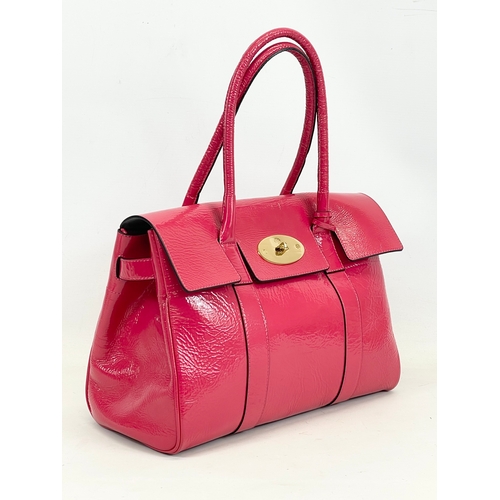 611 - A Mulberry Bayswater leather handbag with cover. 36 x 18 x 45cm