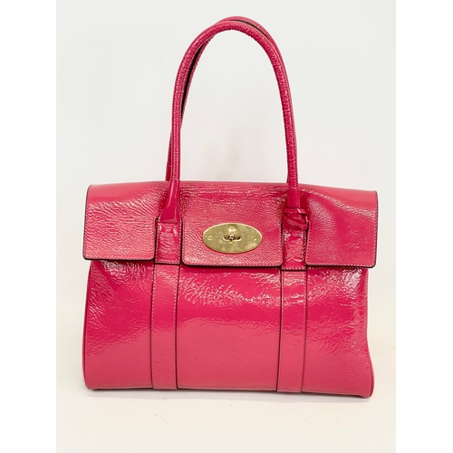 611 - A Mulberry Bayswater leather handbag with cover. 36 x 18 x 45cm