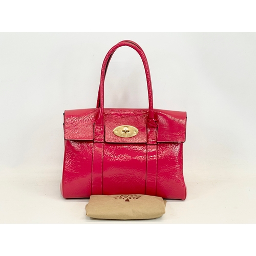 611 - A Mulberry Bayswater leather handbag with cover. 36 x 18 x 45cm