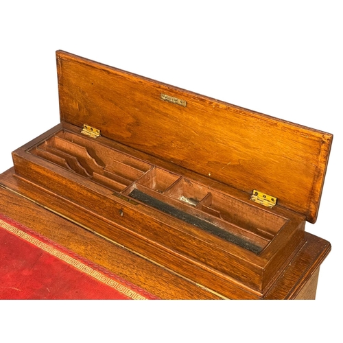 909 - A late Victorian Walnut Davenport desk with leather top. Circa 1880. 55x51x83cm