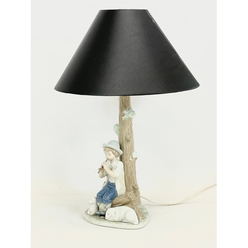 616 - A Nao pottery table lamp. Base measures 29cm without shade.