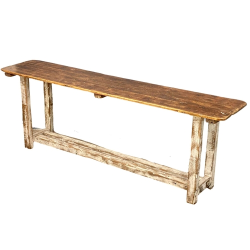 907 - A large early 20th century pine industrial console table. 240x51x83cm