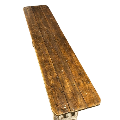 907 - A large early 20th century pine industrial console table. 240x51x83cm