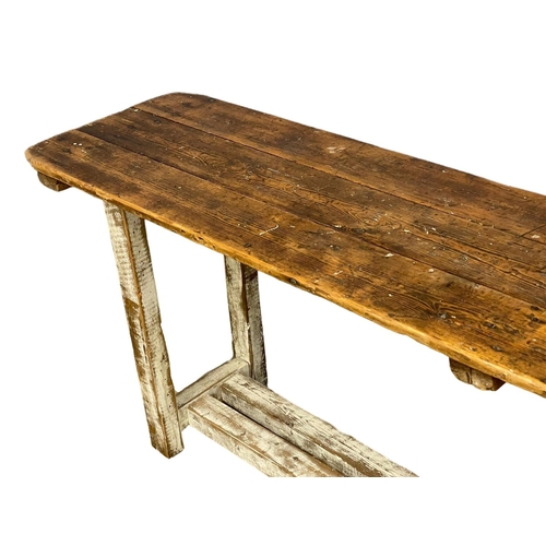 907 - A large early 20th century pine industrial console table. 240x51x83cm