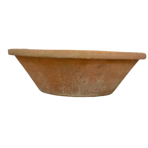 389T - A very large late 19th century French terracotta dough bowl. 71x22cm