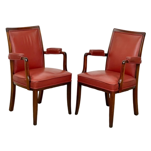 1087 - A pair of good quality mahogany and leather armchairs.