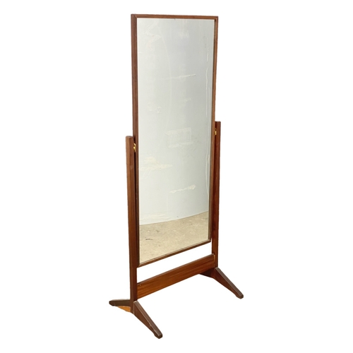 1094 - A Mid Century afromosia / teak cheval dressing mirror. 63x158cm