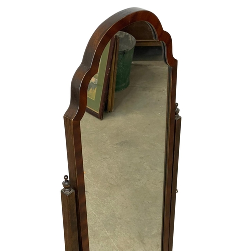 1096 - A vintage mahogany framed cheval mirror. 142cm