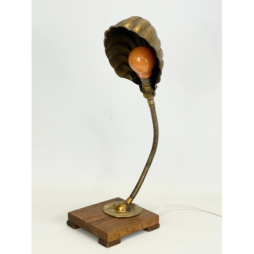 8 - An early 20th century Art Deco brass shell lamp on wooden base. 1920-1930. Working. 15x16x52cm