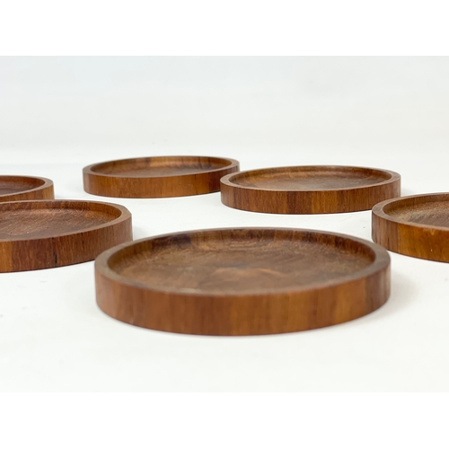 9 - A set of 6 Danish Mid Century teak drinks coasters. 8cm