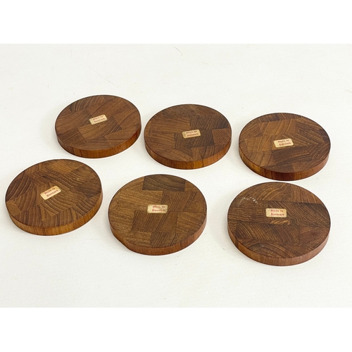 9 - A set of 6 Danish Mid Century teak drinks coasters. 8cm