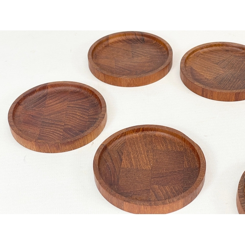 9 - A set of 6 Danish Mid Century teak drinks coasters. 8cm