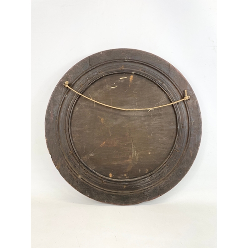 17 - An Edwardian oak framed spinning wheel mirror. 50cm