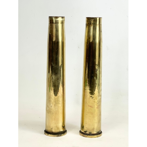 327 - A pair of brass cannon shell vases. 1943.