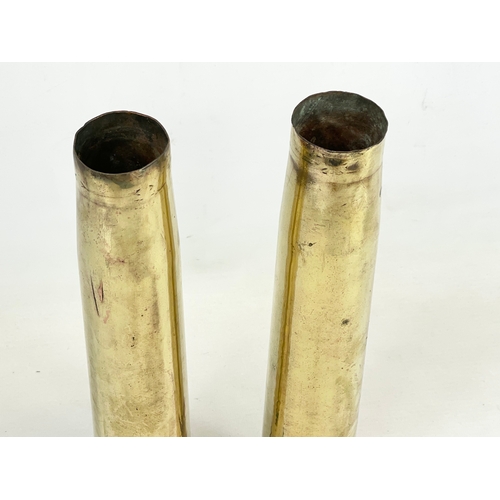 327 - A pair of brass cannon shell vases. 1943.