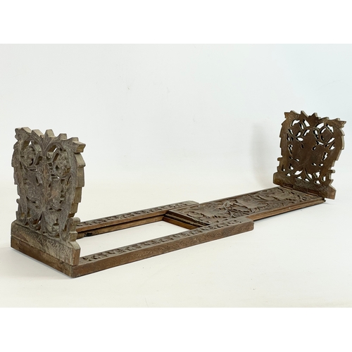 268 - An early 20th century Indian carved teak extending bookstand. Closed 40cm. Open 76cm