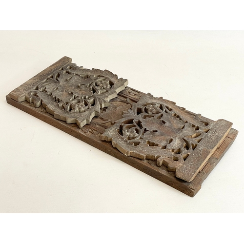 268 - An early 20th century Indian carved teak extending bookstand. Closed 40cm. Open 76cm