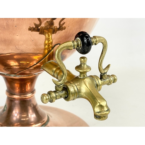 269 - A Victorian copper and brass tea urn. 27x34cm