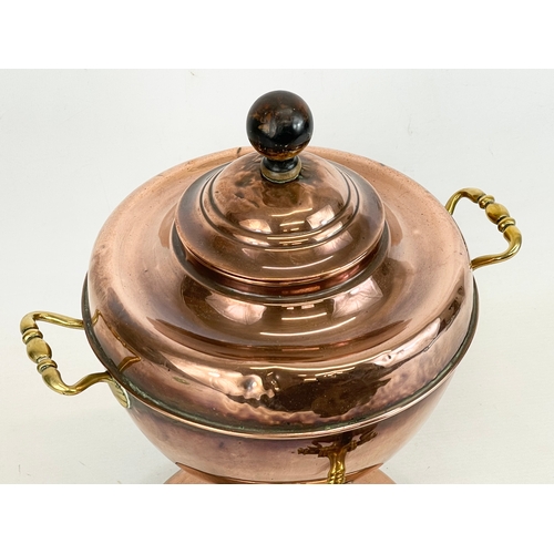 269 - A Victorian copper and brass tea urn. 27x34cm