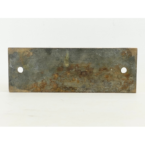 67 - A vintage bronze sign ‘Louvain’ 25x9cm