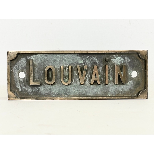 67 - A vintage bronze sign ‘Louvain’ 25x9cm