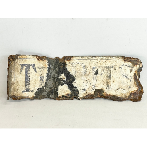 69 - A vintage Tasty Titbits enamel sign. 37cm